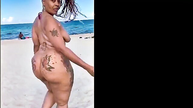 ebony, amateur, american - tattooed american ebony amateur showcases her big butt while strolling on a nude beach