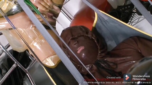 Ts - matrons hoist patient for peeing in latex Ts