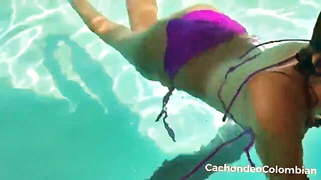 offering cash to a skinny latina as she swims in the pool : waelchi_lottie