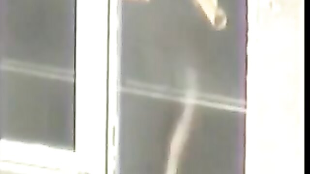 Lovely - girl models clothes in front of a window gcrona