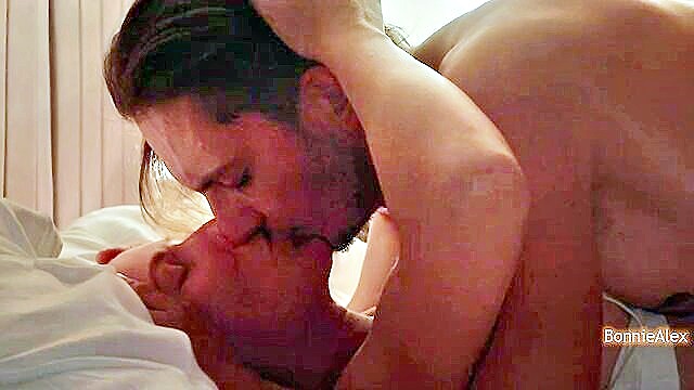intimacy, love making, romantic couple - gentle face kissing during sex