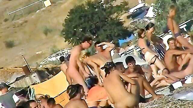 naughty beach bather caught on phone near water : lhermann